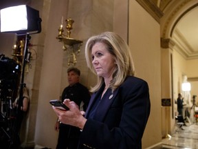 FILE - In this Oct. 26, 2017, file photo, Rep. Marsha Blackburn, R-Tenn., leaves the House chamber on Capitol Hill in Washington. President Donald Trump has endorsed Blackburn in the Republican primary for a U.S. Senate seat from Tennessee. Trump tweeted April 19, 2018, that the sitting congresswoman is a "wonderful woman who has always been there when we have needed her."