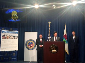 From left, Drug Enforcement Administration Acting Administrator Robert Patterson, Federal Bureau of Investigation Deputy Director David Bowdich, and U.S. Department of State Deputy Assistant Secretary James Walsh, speak at a news conference at the DEA headquarters in Arlington, Va., on Thursday April 12, 2018. Rafael Caro Quintero, a Mexican drug kingpin convicted in the 1985 killing of a DEA agent was added to the FBI's list of most-wanted fugitives. Quintero was mistakenly released from a Mexican prison in 2013 while serving a 40-year sentence for the kidnapping and murder of DEA Special Agent Enrique Camarena Salazar.