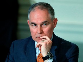 In this Feb. 12, 2018, file photo, Environmental Protection Agency Administrator Scott Pruitt attends a meeting at the White House in Washington. Pruitt flew in coach-class seats on at least two trips when taxpayers weren't footing the bill, despite claims he needed to travel in first class at government expense because of security threats. Copies of Pruitt's official schedule released following a public records request show flights made in August and October to Oklahoma on Southwest Airlines, a carrier that doesn't offer premium-class seats.