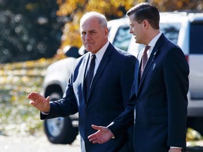 FILE - In this Nov. 29, 2017 file photo, White House Chief of Staff John Kelly, left, walks with then-White House staff secretary Rob Porter to board Marine One on the South Lawn of the White House in Washington. The FBI first flagged "derogatory information" about Porter to White House counsel Don McGahn in March 2017. That's according to a new timeline provided by the FBI to Congress and publicly released April 26, 2018.