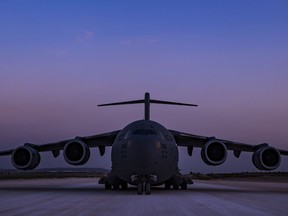 In this image provided by the U.S. Air Force, a C-17 Globemaster III, assigned to the 816th Expeditionary Airlift Squadron, conducts combat airlift operations for U.S. and coalition forces in Iraq and Syria on April 13, 2018. The drama of U.S. and allied missiles strikes on Syria has obscured the fact that the U.S.-led campaign to eliminate the Islamic State from Syria has stalled. This is an illustration of the many-layered complexities of the Syrian conflict.