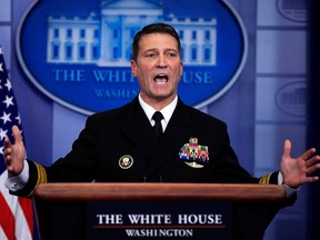 FILE - In this Jan. 16, 2018, file photo, White House physician Dr. Ronny Jackson speaks to reporters during the daily press briefing in the Brady press briefing room at the White House, in Washington. Now it's Washington's turn to examine Jackson. The doctor to Presidents George W. Bush, Barack Obama and now Donald Trump is an Iraq War veteran nominated to head the Department of Veterans Affairs.