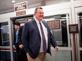 FILE - In this Jan. 25, 2018 file photo, Sen. Jon Tester, D-Mont., arrives for voting at the Capitol in Washington. With a flat-top haircut, three missing fingers and a quite-wide girth, Tester has somehow kept a low profile in Congress. Then he caught the attention of Americans, and President Donald Trump, with startling allegations that toppled Veterans Administration nominee Ronny Jackson.