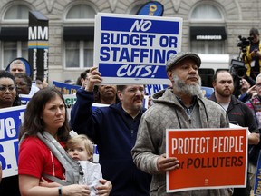 Protesters listen to speakers talk about EPA Administrator Scott Pruitt and the state of the EPA during a protest by the American Federation of Government Employees union, Wednesday, April 25, 2018, in Washington.