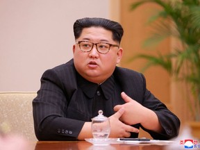 In this April 9, 2018, photo provided by the North Korean government, North Korean leader Kim Jong Un attends a meeting of the Political Bureau of the Central Committee of the Workers' Party of Korea, in Pyongyang, North Korea. Independent journalists were not given access to cover the event depicted in this image distributed by the North Korean government. The content of this image is as provided and cannot be independently verified. Korean language watermark on image as provided by source reads: "KCNA" which is the abbreviation for Korean Central News Agency. A U.S. university institute at the cutting edge of research on North Korea says the South Korean government has terminated its funding, forcing it to close after it rejected demands to change its leadership. (Korean Central News Agency/Korea News Service via AP)