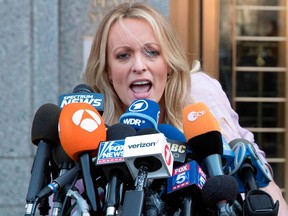 In this April 16, 2018 photo, adult film actress Stormy Daniels outside federal court in New York.  Stormy Daniels filed a defamation complaint in federal court in New York on Monday. At issue is a tweet Trump made in which he dismissed a composite sketch that Daniels says depicts a man who threatened her in 2011 to stay quiet about her alleged sexual encounter with Trump.