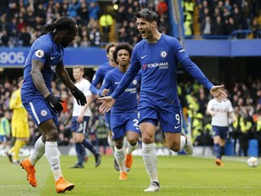 Chelsea's Alvaro Morata, right, celebrates after scoring the opening goal during the English Premier League soccer match between Chelsea and Tottenham Hotspur at Stamford Bridge stadium in London, Sunday, April 1, 2018.