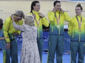 Camilla, the Duchess of Cornwall, presents the gold medal to Australia's team, from left, Annette Edmondson, Amy Cure, Ashlee Ankudinoff and Alexandra Manly during ceremonies for the Women's 4000m Team Pursuit at the Anna Meares Velodrome during the 2018 Commonwealth Games in Brisbane, Australia, Thursday, April 5, 2018.