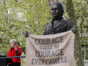 Britain's Prime Minister Theresa May speaks after the unveiling a statue of Millicent Fawcett in Parliament Square, London, Tuesday, April 24, 2018.  May has helped unveil a statue of women's rights campaigner Millicent Fawcett outside Britain's Parliament. Fawcett is the first woman to be commemorated there alongside 11 statues of men including Nelson Mandela and Winston Churchill.