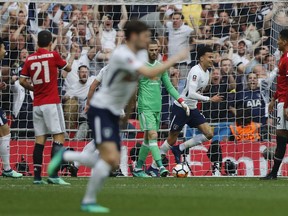 Tottenham Hotspur's Dele Alli, third right celebrates after scoring the opening goal of the game during the English FA Cup semifinal soccer match between Manchester United and Tottenham Hotspur at Wembley stadium in London, Saturday, April 21, 2018.