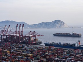 In this March. 29, 2018 photo, container ships is docked at the Yangshan port in Shanghai. President Donald Trump has instructed the U.S. trade representative to consider slapping an additional $100 billion in tariffs on Chinese goods in a dramatic escalation of the trade dispute between the two countries. The news comes a day after Beijing announced plans to tax $50 billion in U.S. products, including soybeans and small aircraft, in response to a U.S. move earlier this week to slap tariffs on $50 billion in Chinese imports. (AP Photo)