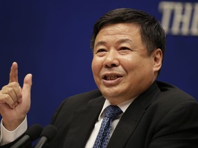 Chinese Finance Vice Minister Zhu Guangyao speaks during a press conference on Sino-US trade issues at the State Council Information Office in Beijing, Wednesday, April 4, 2018. China on Wednesday, April 4, 2018, vowed to take measures of the "same strength" in response to a proposed U.S. tariff hike on $50 billion worth of Chinese goods in a spiraling dispute over technology policy that has fueled fears it might set back a global economic recovery.