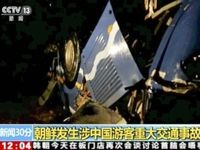 In this Sunday, April 22, 2018, image taken from video footage by China's CCTV via AP Video, a bus which carries Chinese and North Koreans is seen overturned after an accident in North Hwanghae province, south of Pyongyang, North Korea.