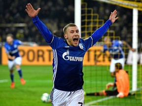 FILE - In this Nov. 25, 2017 file photo Schalke's Max Meyer celebrates after Naldo scored Schalke's 4th goal during the German Bundesliga soccer match between Borussia Dortmund and FC Schalke 04 in Dortmund, Germany. Schalke attacking midfielder Max Meyer will become the latest player to leave the club on a free transfer at the end of the season after failing to reach agreement over a contract extension. Schalke sporting director Christian Heidel says Thursday, April 26, 2018 , "We're dealing with the situation very professionally.
