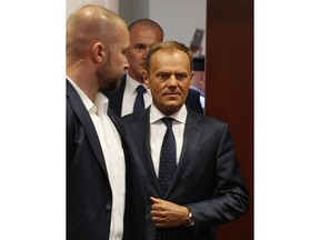 European Union Council President Donald Tusk enters the court building to testify as witness in the trial into the 2010 airplane crash in Russia that killed Poland's President Lech Kaczynski and 95 other prominent Poles, at a time when Tusk was Poland's prime minister in Warsaw, Poland, Monday, April 23, 2018.