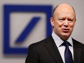 FILE - In this May 18, 2017 file photo, CEO of Deutsche Bank John Cryan poses for photographers at the beginning of the bank's annual shareholders meeting in Frankfurt, Germany. German media are reporting that Christian Sewing, currently a member of Deutsche Bank's management board, may become the new CEO of Germany's biggest lender replacing John Cryan. News magazine Spiegel Online and daily Handelsblatt reported Sewing will be nominated at a board meeting Sunday night, April 8, 2018.