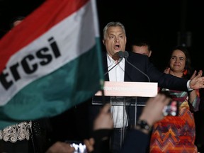 Hungarian Prime Minister Viktor Orban addresses his supporters in Budapest, Hungary, Sunday, April 8, 2018. Preliminary results show populist Hungarian Prime Minister Viktor Orban has easily won a third consecutive term and his Fidesz party has regained its super majority in the parliamentary election.