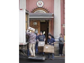 Goods are loaded onto a truck outside the U.S. consulate in St.Petersburg, Russia, Saturday, March 31, 2018. Russia announced the expulsion of more than 150 diplomats, including 60 Americans, on Thursday and ordered the closing of the U.S. consulate in St. Petersburg by Saturday evening in retaliation for the wave of Western expulsions of Russian diplomats over the poisoning of an ex-spy and his daughter in Britain.