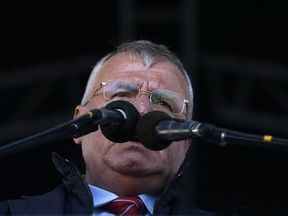 FILE - In this April 20, 2016 file photo, Serbian far right leader Vojislav Seselj speaks during a pre-election rally in Novi Sad, Serbia. A Croatian parliamentary delegation has cut short a visit to neighboring Serbia after a far-right leader convicted of war crimes stamped on the Croatian national flag and insulted visiting officials. Croatian state TV said Wednesday, April 18, 2018 the delegation decided to return home after the incident in the Serbian parliament involving Serbian Radical Party leader Vojislav Seselj.