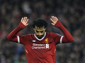 Liverpool's Mohamed Salah celebrates after scoring his side's second goal during the Champions League semifinal, first leg, soccer match between Liverpool and Roma at Anfield Stadium, Liverpool, England, Tuesday, April 24, 2018.