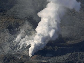 CORRECTS YAER - In this April 19, 2018, photo, volcanic smoke billows from Mt. Io, part of the Kirishima mountain range on Japan's southern main island of Kyushu, taken over Ebino city, Miyazaki prefecture. The Meteorological Agency said Friday, April 20, 2018  that Mt. Io erupted for the first time since 1768, spewing smoke and ash high into the sky. The agency has expanded a no-go zone to the entire mountain from just around the volcano's crater. (Kyodo News via AP)