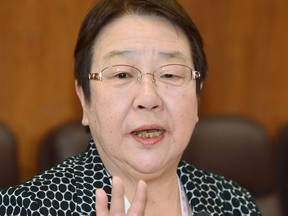 Tomoko Nakagawa, mayor of Takarazuka City, speaks to media in Takarazuka, Friday April 6, 2018. A female mayor in western Japan has protested sumo's male-only tradition in her speech she was forced to make outside of the ring _ unlike her male counterparts who go inside _ seeking a change.