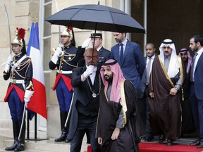 Saudi Arabia Crown Prince Mohammed bin Salman, center, walks out after his meeting with French Prime Minister Edouard Philippe, center back, in Paris, Monday April 9, 2018. Crown Prince Mohammed bin Salman is expected to sign a "strategic partnership" with Macron in the Elysee Palace on Tuesday. France is hoping to profit from the prince's shake-up of the conservative kingdom to forge a new kind of commercial relationship.