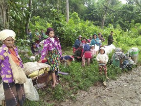 In this photo provided by Labram Hkun Awng, Kachin civilians displaced by fighting between the Myanmar military and Kachin guerrillas take shelter in a jungle close to Tanai, northern Kachin state, Myanmar Thursday, April 19, 2018. Community leaders from the Christian ethnic Kachin community have called for urgent medical attention for about 2,000 civilians, including pregnant women and the elderly, trapped in the jungle where they fled to escape clashes between the Myanmar's army and the Kachin guerrillas in the country's north.