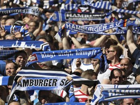 Hamburg fans support their team  during the German Bundesliga soccer match between Hamburger SV and SC Freiburg, in Hamburg, Germany, Saturday, April 21, 2018.