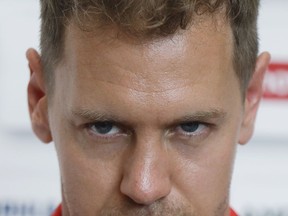 Ferrari driver Sebastian Vettel of Germany gremaces as he answers to reporters at the Formula One Bahrain International Circuit in Sakhir, Bahrain, Thursday, April 5, 2018. The Bahrain Formula One Grand Prix will take place here on Sunday.