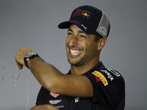 Red Bull driver Daniel Ricciardo of Australia smiles during a news conference at the Baku Formula One city circuit, in Baku, Azerbaijan, Thursday, April 26, 2018. The Formula one race will be held on Sunday.