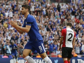 Chelsea's Alvaro Morata celebrates after scoring his side second goal during the English FA Cup semifinal soccer match between Chelsea and Southampton at the Wembley stadium in London, Sunday, April 22, 2018.