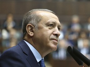 Turkey's President Recep Tayyip Erdogan, delivers a speech at his ruling Justice and Development (AKP) Party weekly meeting in Ankara, Turkey, Tuesday, April 17, 2018. The ruling party will evaluate a call for early presidential and parliamentary elections, scheduled for 2019, made by the nationalist leader, Devlet Bahceli, who suggested Aug. 26, 2018 as a possible date, saying "there is no point in prolonging this any longer." Following a narrowly approved referendum last year, Turkey is switching from a parliamentary system to a presidential system that consolidates most powers in the hands of the president.
