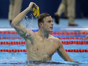 FILE - In this Aug. 10, 2016, file photo, Australia's Kyle Chalmers celebrates winning the gold in the men's 100-meter freestyle during the swimming competitions at the 2016 Summer Olympics in Rio de Janeiro, Brazil. More than 6,600 athletes and officials from across the world will converge on the Gold Coast for the 21st edition of the Commonwealth Games, the quadrennial multi-sports event for 71 countries and territories of the British Commonwealth.