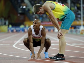 Canada's Damian Warner and Australia's Cedric Dubler react after their heat in the 400m of the decathlon at Carrara Stadium during the 2018 Commonwealth Games on the Gold Coast, Australia, Monday, April 9, 2018.