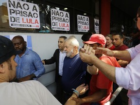 Brazil's former President Luiz Inacio Lula da Silva is seen in front of the metal workers union headquarters in Sao Bernardo do Campo, Brazil, Saturday, April 7, 2018.