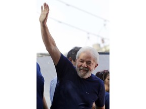 Brazil's former President Luiz Inacio Lula da Silva greets supporters in front of the metal workers union headquarters in Sao Bernardo do Campo, Brazil, Saturday, April 7, 2018. Da Silva, the once wildly popular leader, who rose from poverty to lead Latin America's largest nation, had until 5 p.m. local time Friday, to present himself to police in the city of Curitiba to begin serving a sentence of 12 years and one month for a corruption conviction but he defied the order to turn himself in.