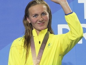 Gold medalist Ariarne Titmus from Australia waves during medal ceremonies in the women's 400m freestyle final at the Aquatic Centre during the 2018 Commonwealth Games on the Gold Coast, Australia, Tuesday, April 10, 2018.