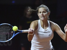 Germany's Julia Goerges returns a shot to Czech Republic's Karolina Pliskova during a match of  the tennis Fed Cup semifinal between Germany and Czech Republic, in Stuttgart, Germany, Sunday, April 22, 2018.