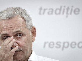 FILE- In this Thursday, June 15, 2017, file photo, the chairman of the Social Democratic Party Liviu Dragnea wipes his eye during a press conference in Bucharest, Romania. Romania's most powerful politician heads for the final hearing in a corruption case on Wednesday, April 25, 2018, days after the U.S. State Department said corrupt practices remain widespread at every level of government in the European Union member.