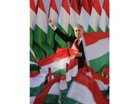 Prime Minister Viktor Orban's waves during the final electoral rally of his Fidesz party in Szekesfehervar, Hungary, Friday, April 6, 2018. Hungarians will vote Sunday in parliamentary elections, choosing 199 lawmakers and polls expect Prime Minister Viktor Orban to win a third consecutive term and his fourth overall since 1998.