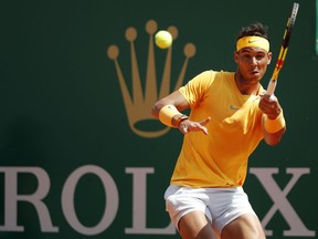 Spain's Rafael Nadal returns the ball to Bulgaria's Gregor Dimitrov during their semifinal singles match of the Monte Carlo Tennis Masters tournament in Monaco, Saturday April 21, 2018.