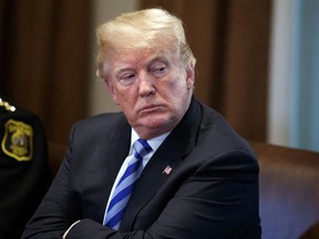 U.S. President Donald Trump listens during a roundtable on immigration policy in California, in the Cabinet Room of the White House, Wednesday, May 16, 2018, in Washington.