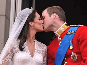 April 29, 2011: Britain's Prince William and his wife Catherine, Duchess of Cambridge, kiss on the balcony of Buckingham Palace in London, following their wedding.
