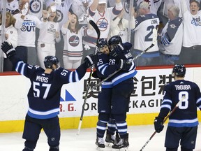 Mark Scheifele congratulates Jets teammate Blake Wheeler after his empty-net goal against the Nashville Predators in Game 3 of their Western Conference second round series on Tuesday night at Bell MTS Place in Winnipeg.