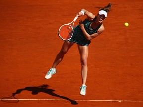Alize Cornet serves to  Elina Svitolina in the first round of the Madrid Open on May 5.