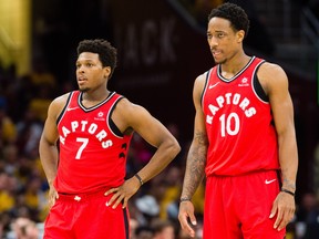 Toronto Raptors guards Kyle Lowry (left) and DeMar DeRozan wait for a free throw in Game 4 against the Cleveland Cavaliers on May 7.