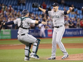 James Paxton of the Seattle Mariners is congratulated by catcher Mike Zunino after throwing a no-hitter against the Blue Jays at Rogers Centre in Toronto on Tuesday night.
