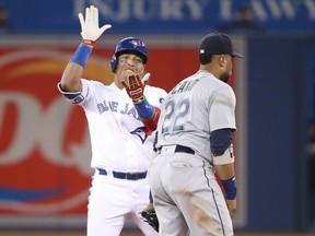 Yangervis Solarte of the Blue Jays celebrates after hitting an RBI double in the eighth inning against the Seattle Mariners during their game Wednesday night at Rogers Centre in Toronto.