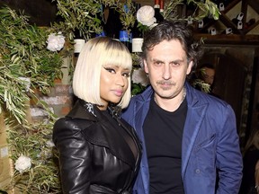 Giovanni Morelli seen here with Nicki Minaj at the ELLE x Stuart Weitzman celebration of Morelli's debut collection for Stuart Weitzman, hosted by Nina Garcia on May 16, 2018 in New York City.